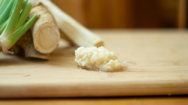 homemade horseradish sitting on a wooden cutting board