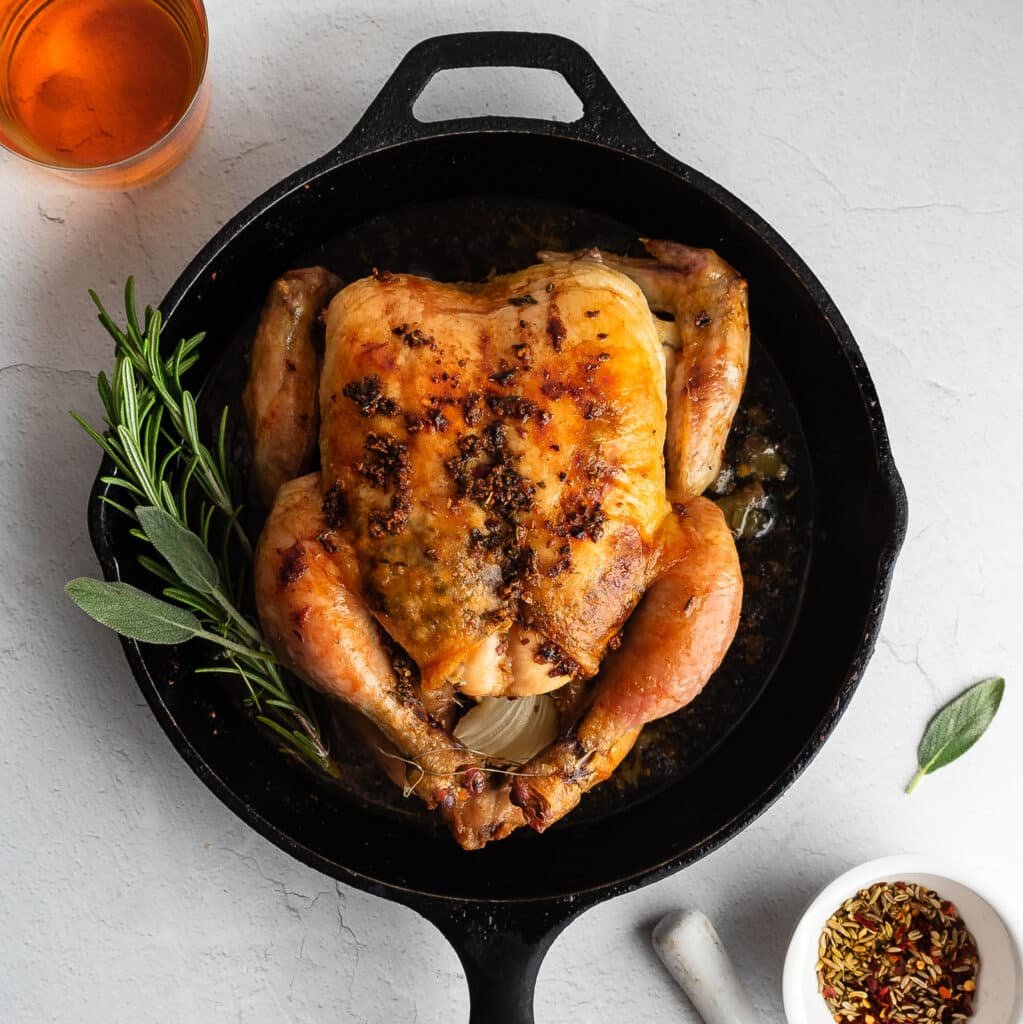 slow-roasted chicken in a cast-iron skillet