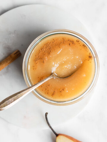 pear applesauce with cinnamon on a white background