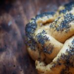 freshly baked bread coated with poppy seeds