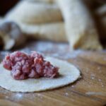 raw pelmeni dumpling stuffed with ground meat