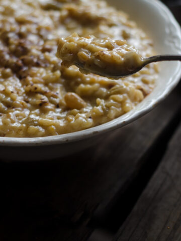 closeup ofsweet risotto in dish on wooden background