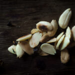 toasted almonds on wooden surface