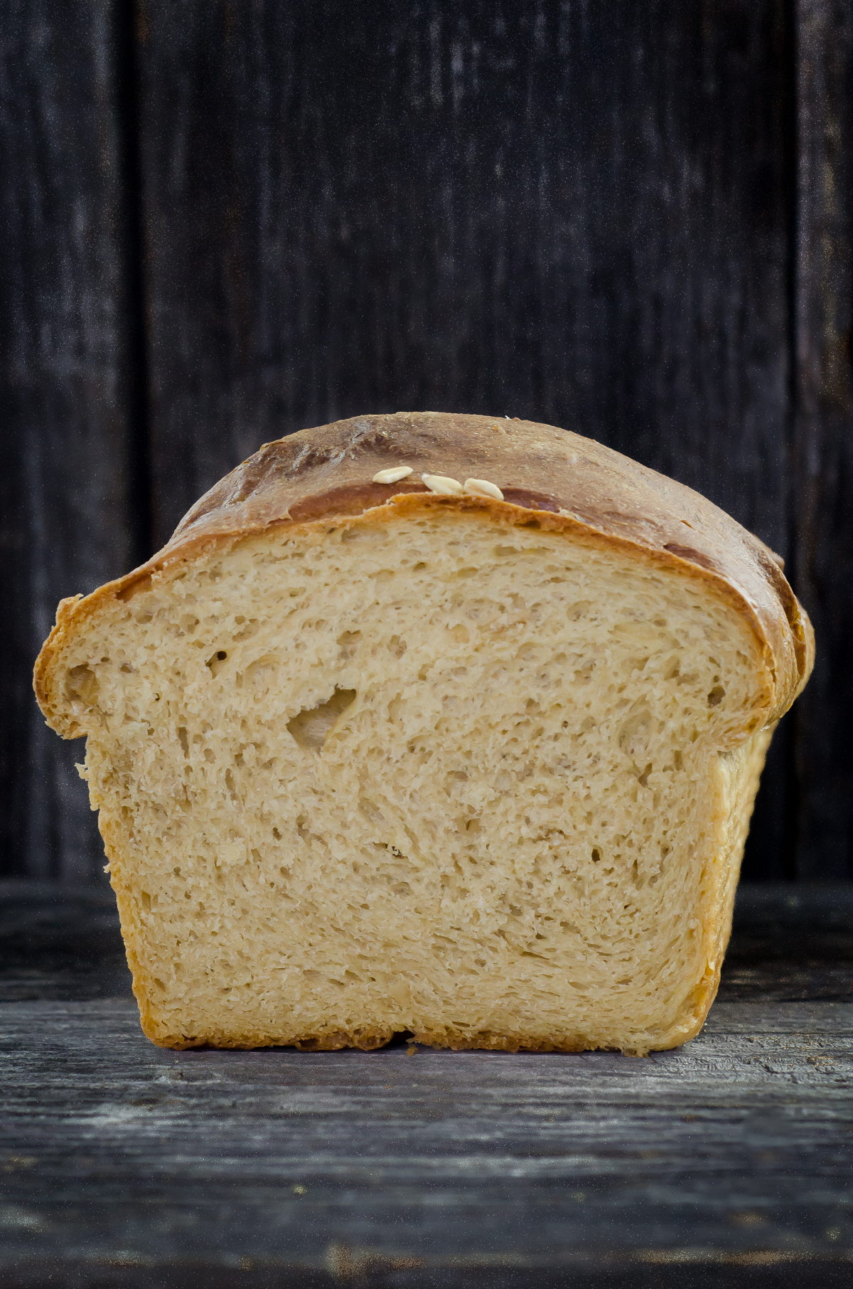Milk and Honey Sandwich Bread made with Identity-Preserved Whole White Wheat Flour, Oats, Milk, Honey and yeast. It's super easy, with a great crumb and crust. 