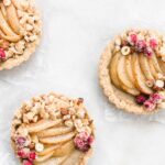 tarts with pears, berries, and hazelnuts