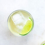 homemade water kefir in a cup with lime and ice