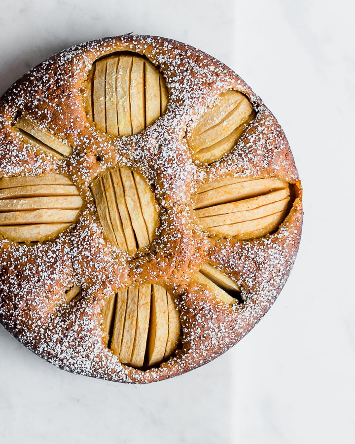 Einkorn Apple Cake on a marble board.