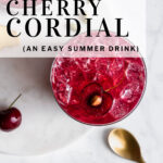 pinterest pin cherry cordial in a cup with ice