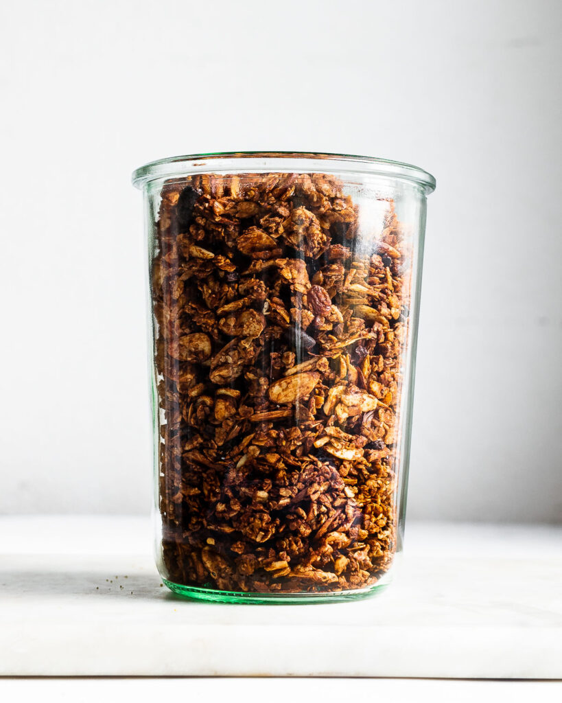 chocolate granola in a clear glass jar