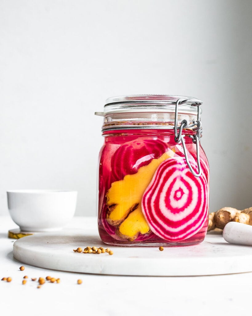 Chioggia beets, ginger, and coriander fermenting in a clamped Fido jar.