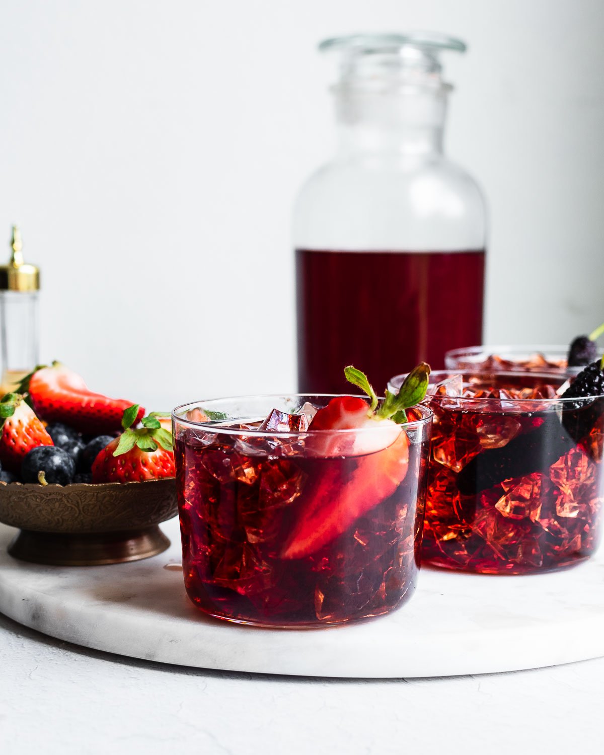 Bachelor's jam poured over ice garnished with berries