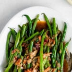 Green Beans with Bacon on a white plate