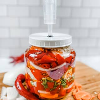 Fermentation Kit by Cultures for Health filled with hot peppers, onions and carrots
