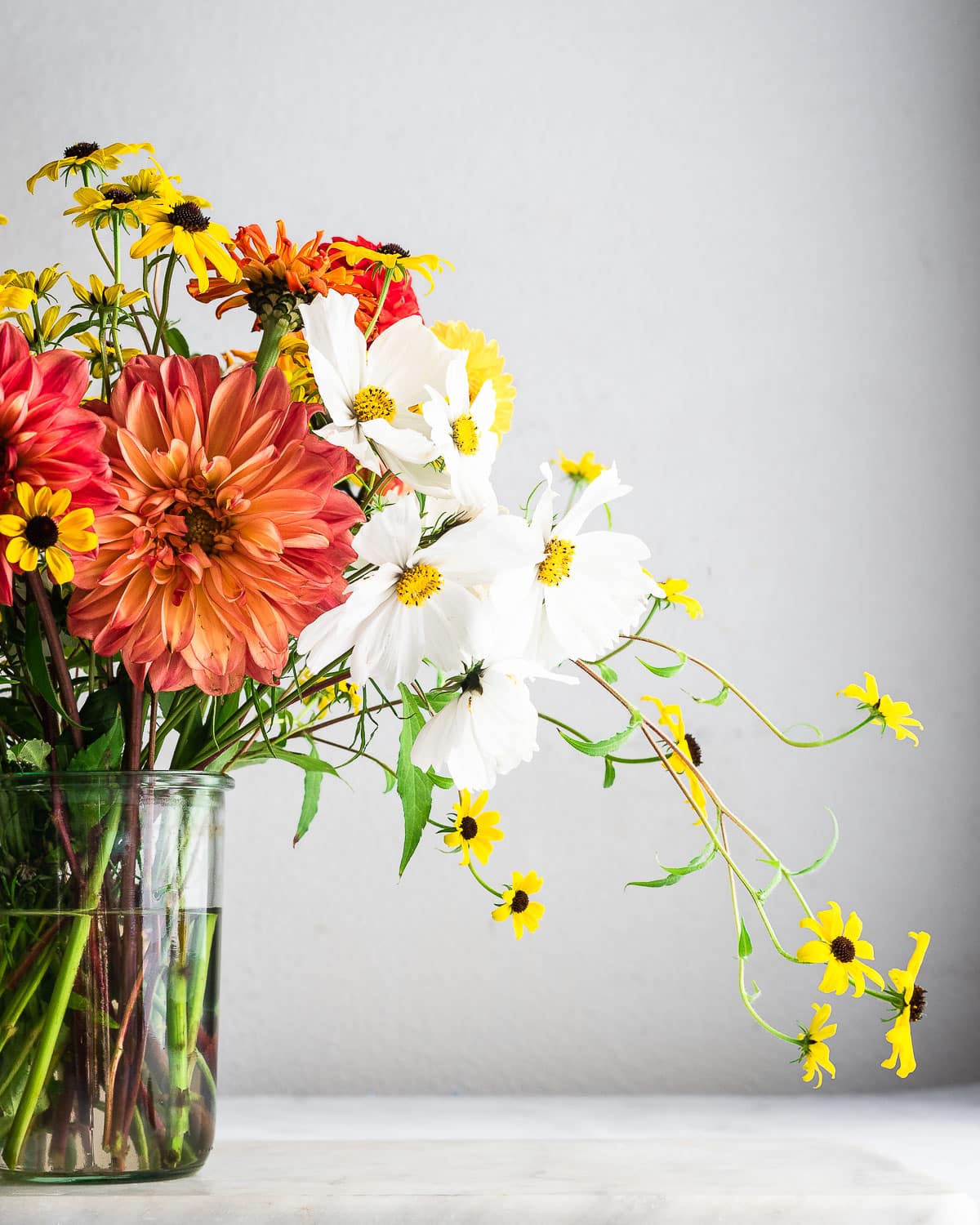 Flowers in clear vase with white background