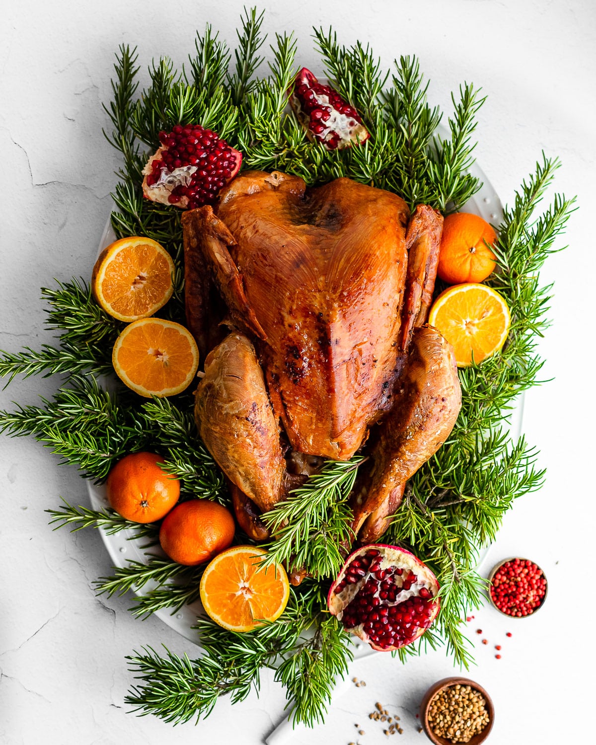 Maple-Brined Turkey on Bed of Rosemary Garnished with Pomegranates and Oranges