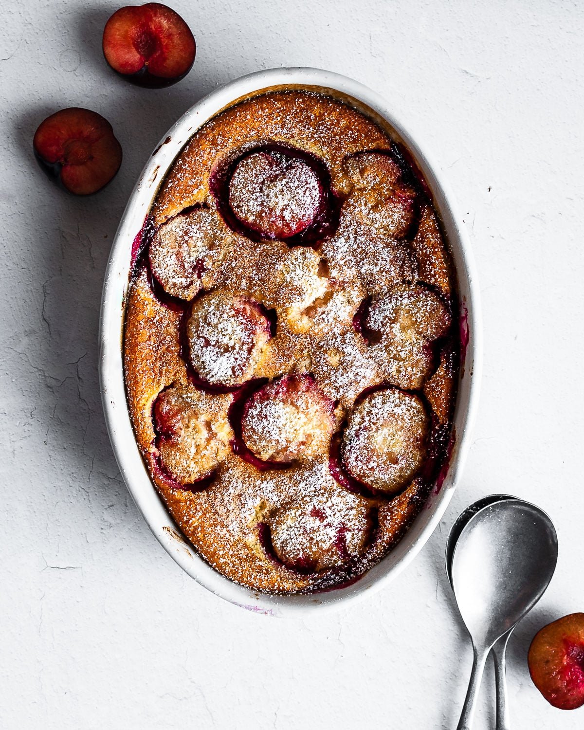 Plum clafoutis in a ceramic dish