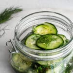 quick pickles in a jar garnished with dill