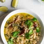 Green Chili Chicken garnished with cilantro in a white bowl